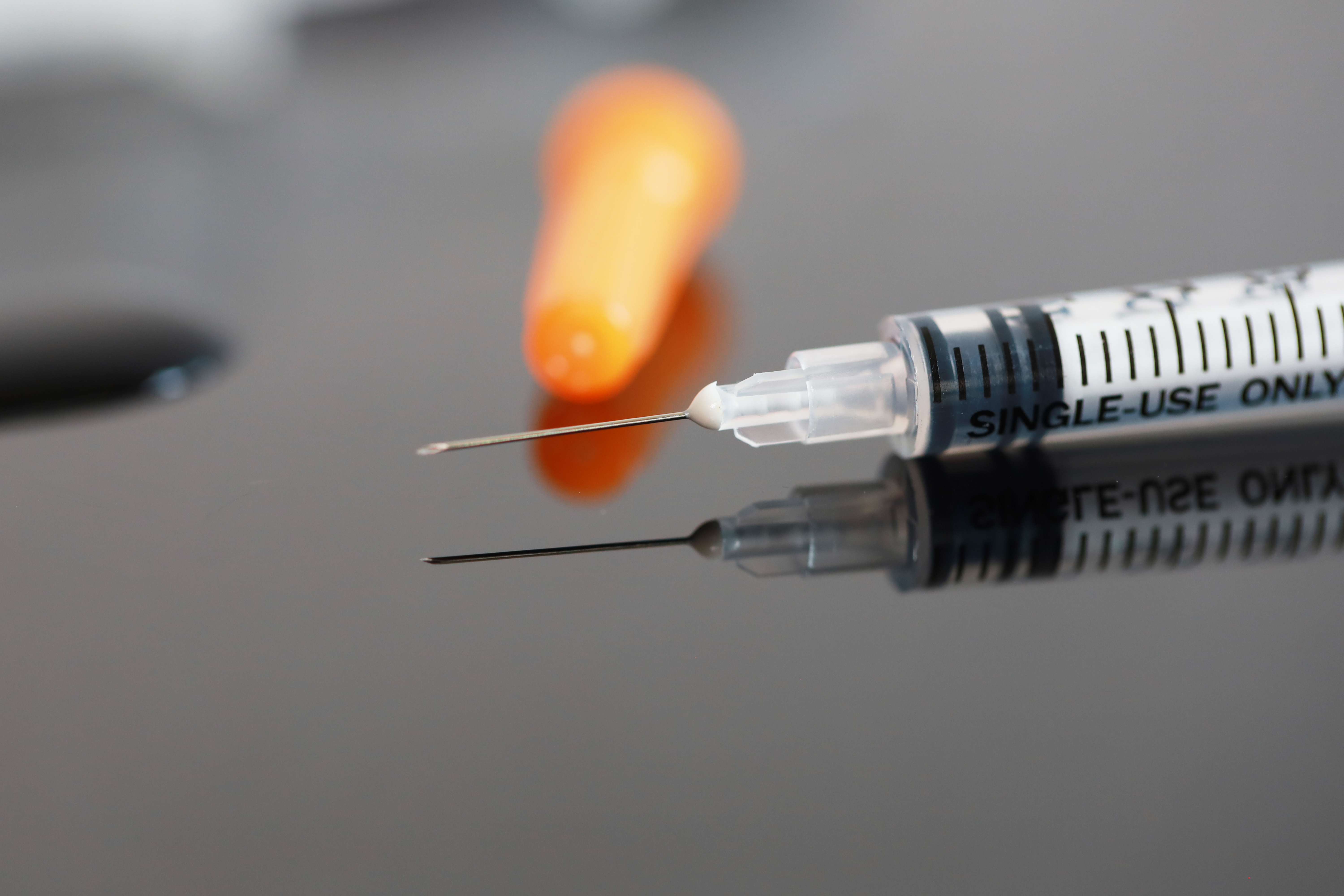 image of a syringe with a needle